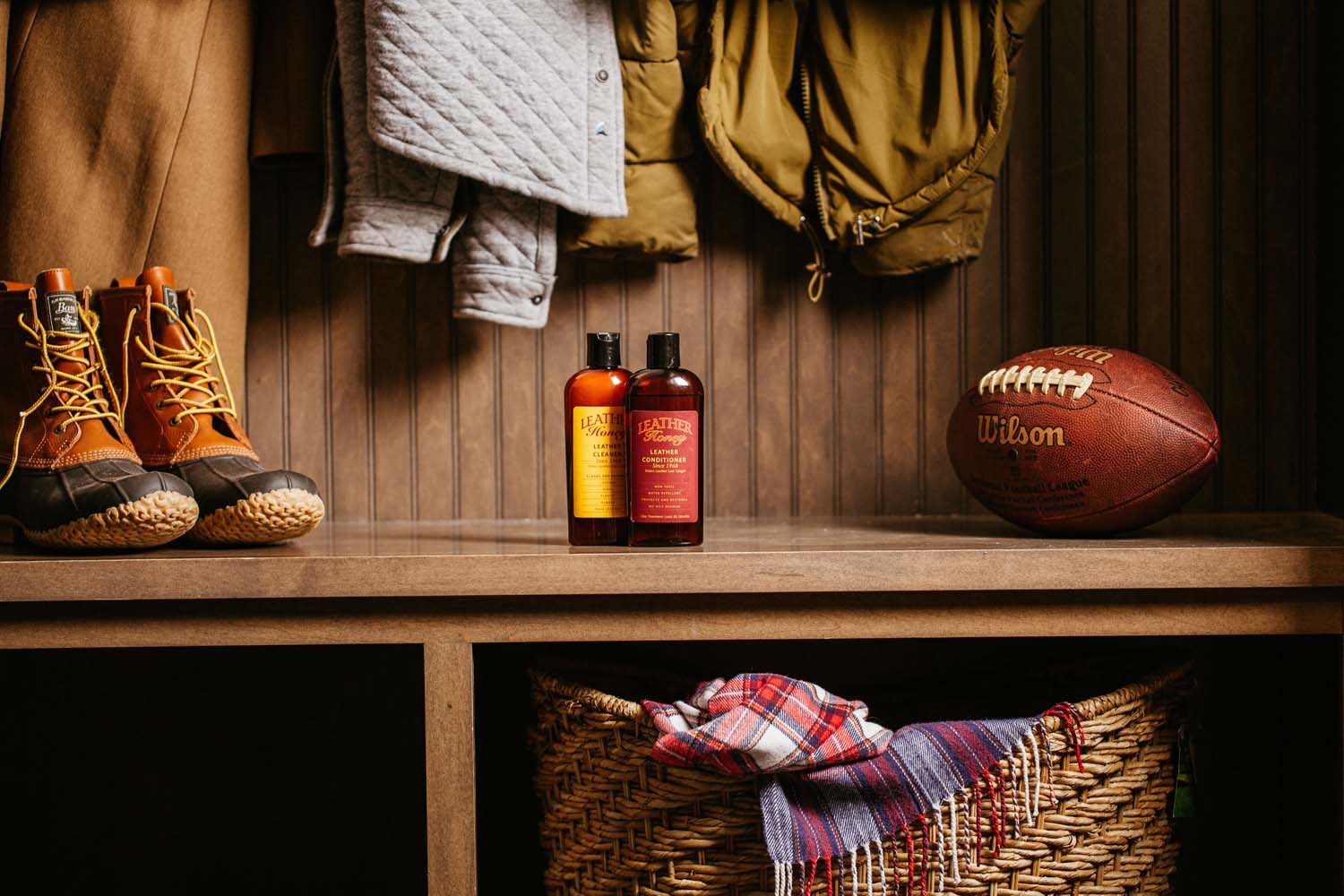 leather honey leather care products with a football and boots